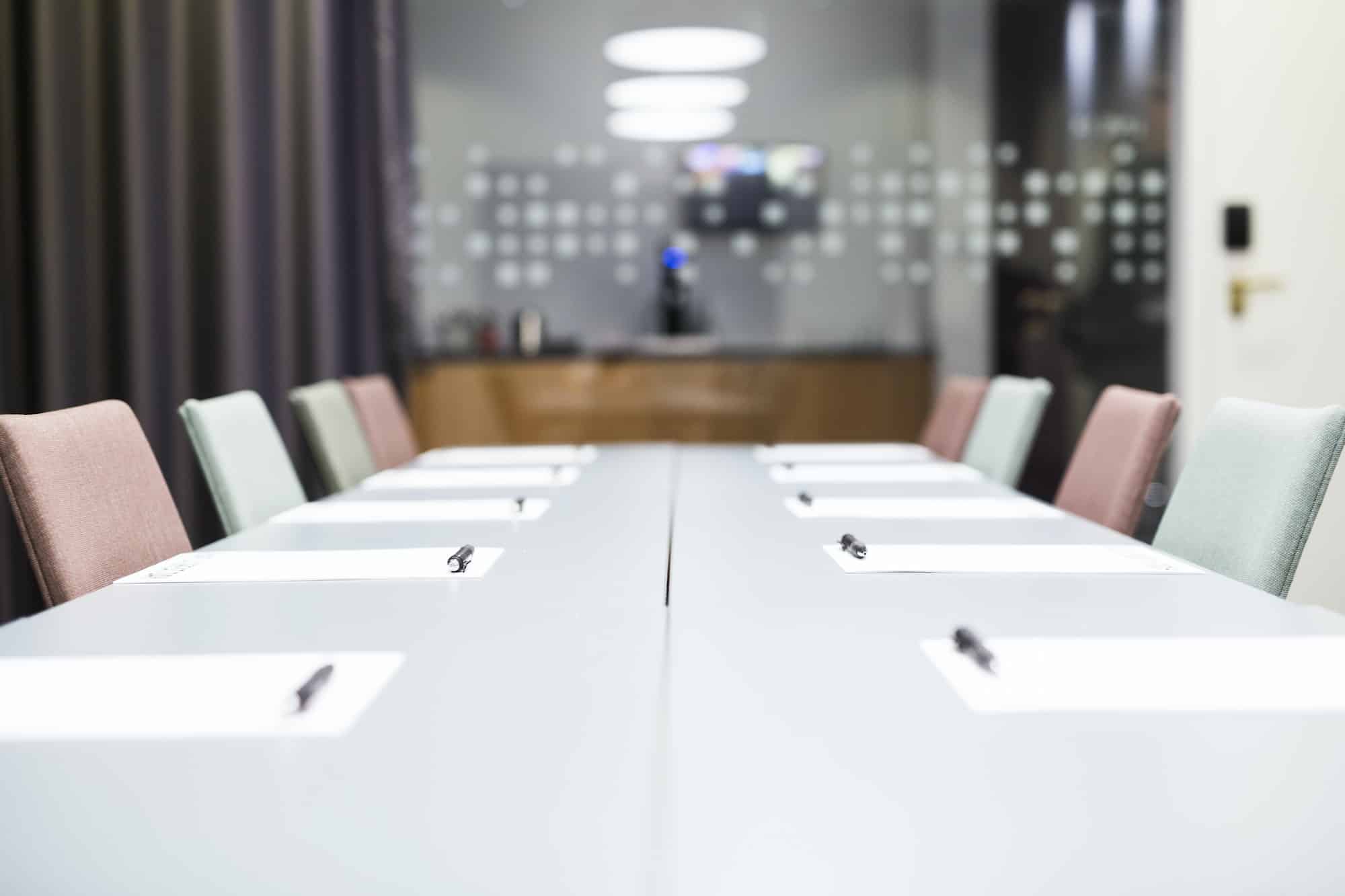 Papers and pen on conference table in office